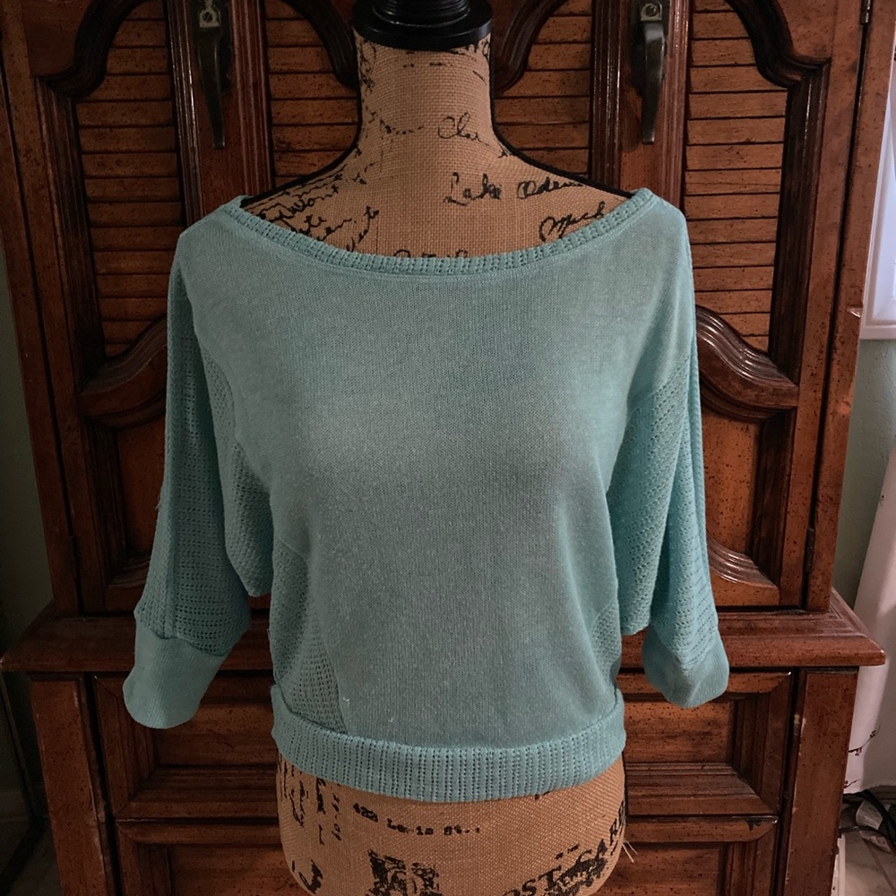 Woman’s teal top, size medium.